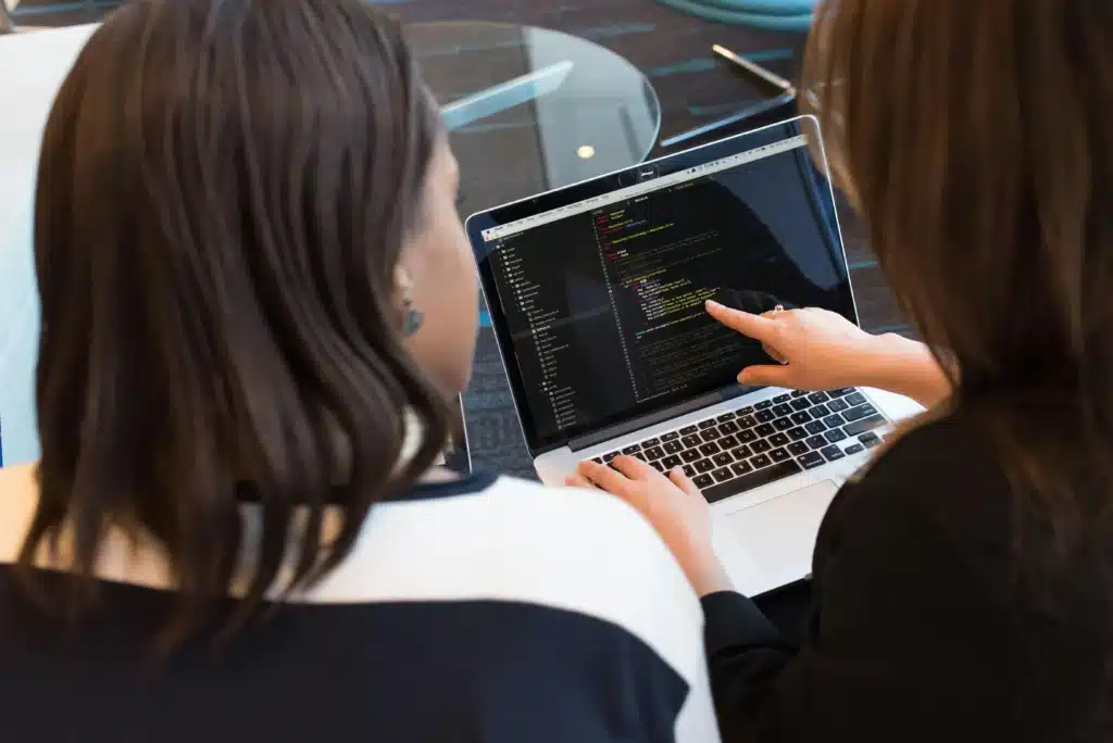 Gormley Ontario IT team of women working on code on Macbook