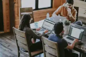 Group of people working on laptops