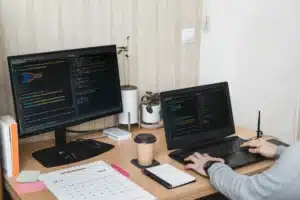 Man working at desk on laptop