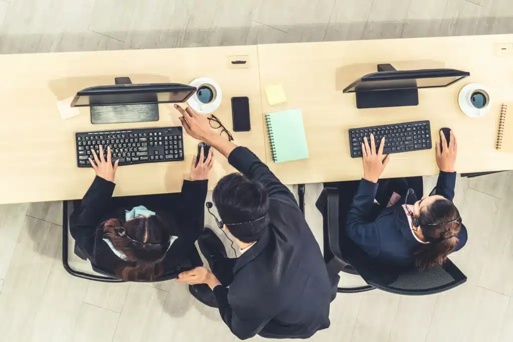 Burlington IT services team working at desktop wearing headsets