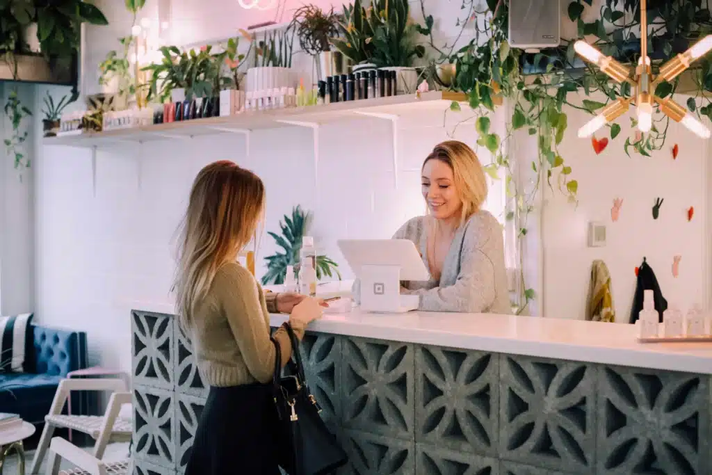 Woman checking out with cashier