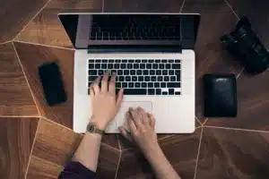 Person typing on Macbook