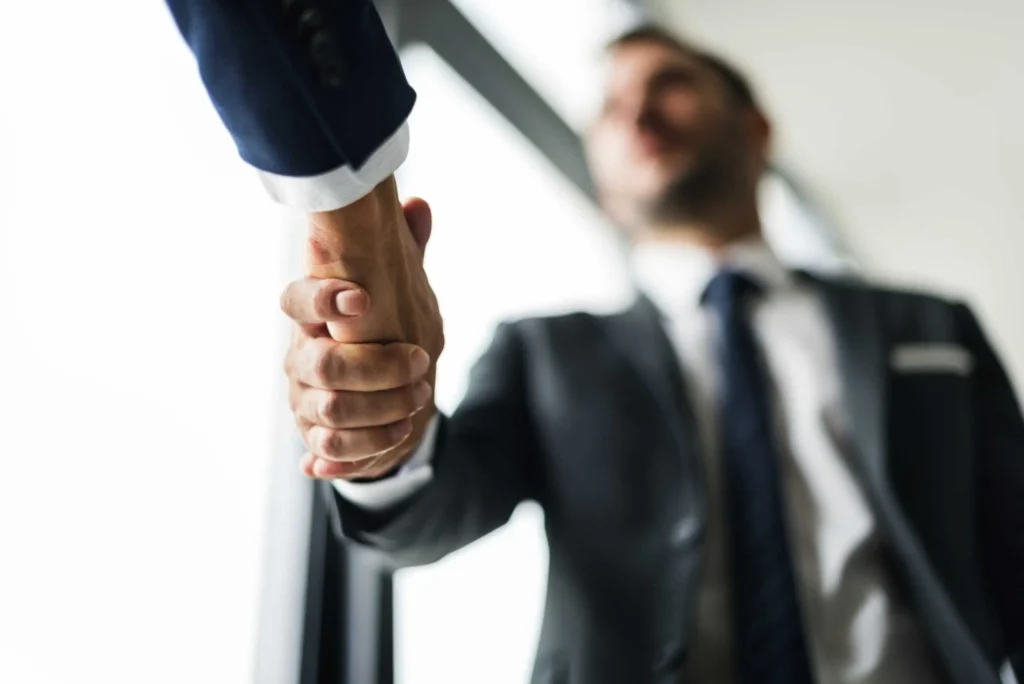 Two businessmen exchanging a handshake