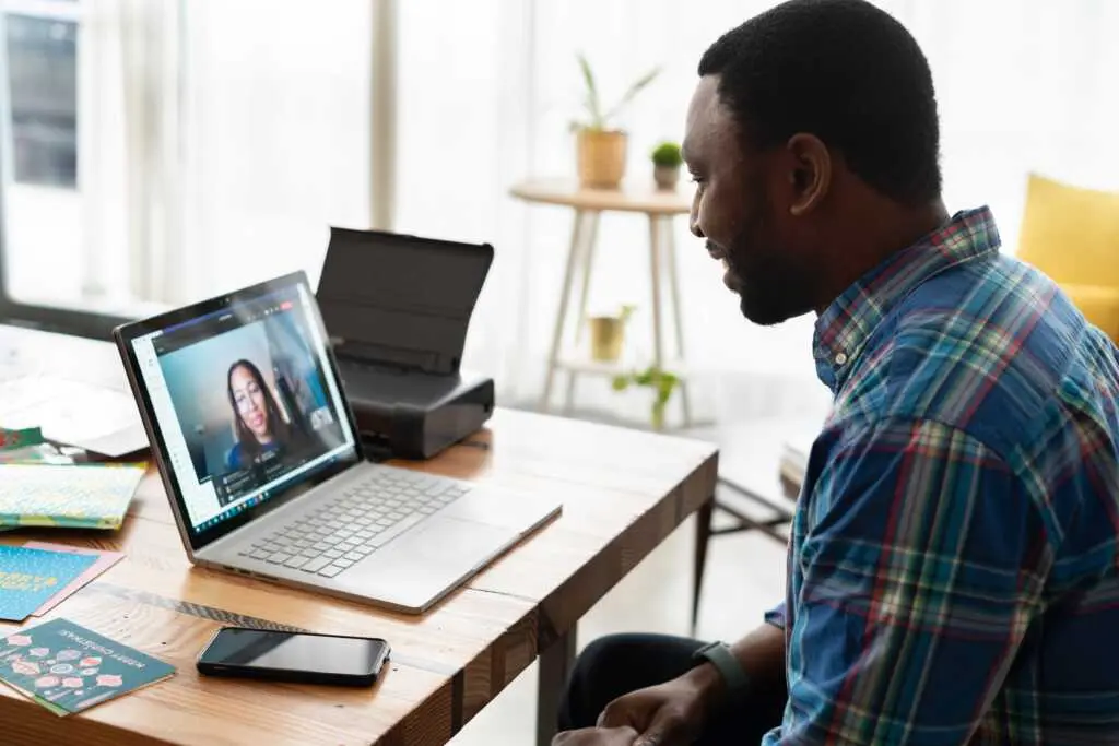 Man having a video call on a laptop.