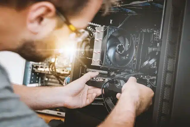 man repairing a CPU tower
