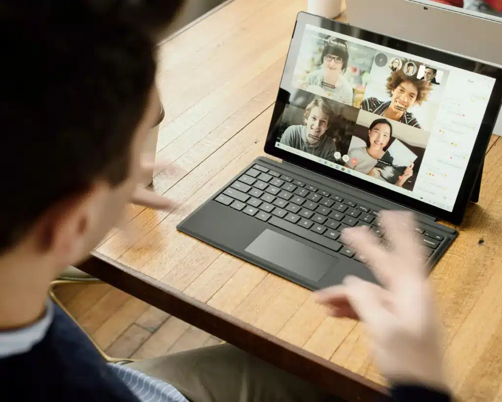 Man talking on video call on Google Surface at desk