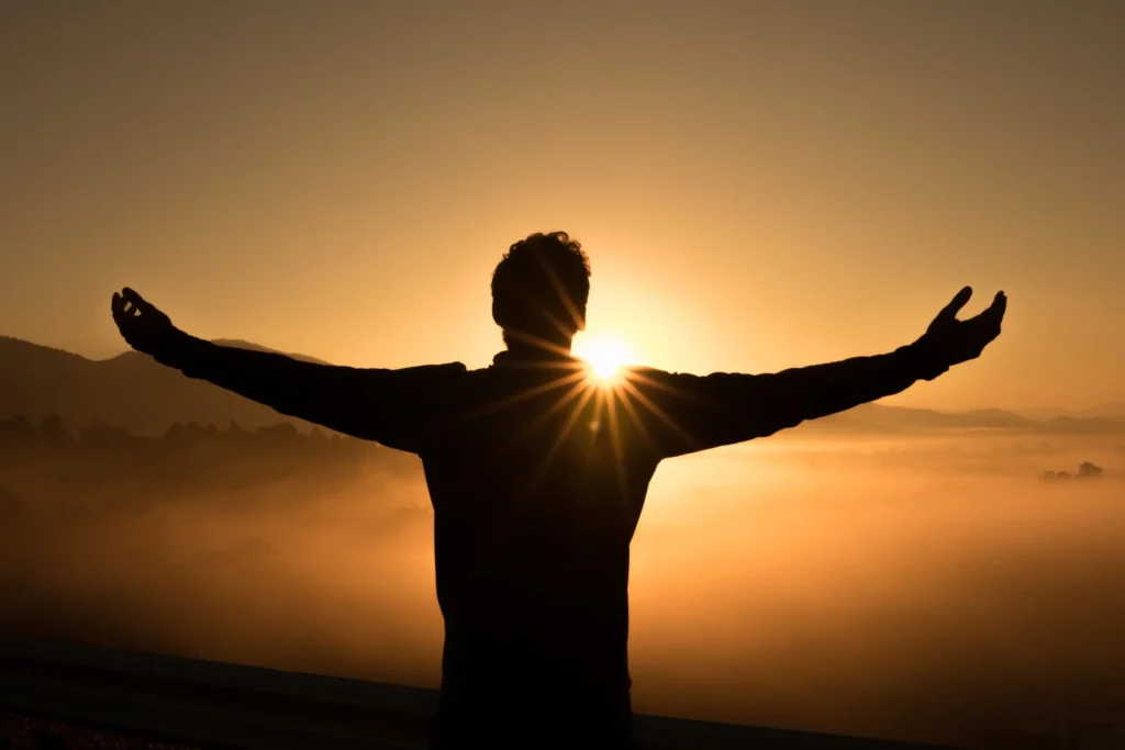 man looking at the sunset