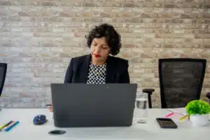 Woman sitting at laptop