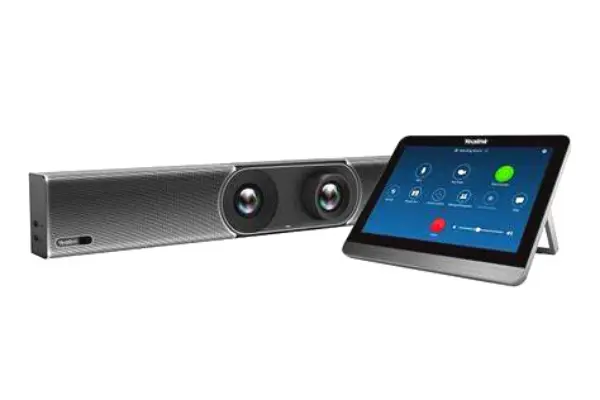 A set of speakers next to a tablet.
