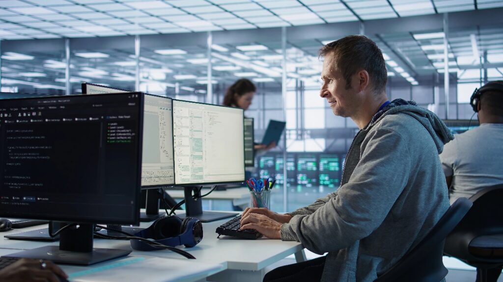 IT professional monitoring business systems and responding to alerts as part of proactive managed IT services to reduce downtime and prevent technology issues.